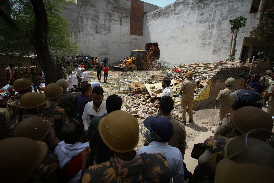 Yogi bulldoze the houses | Image Credit - AP News